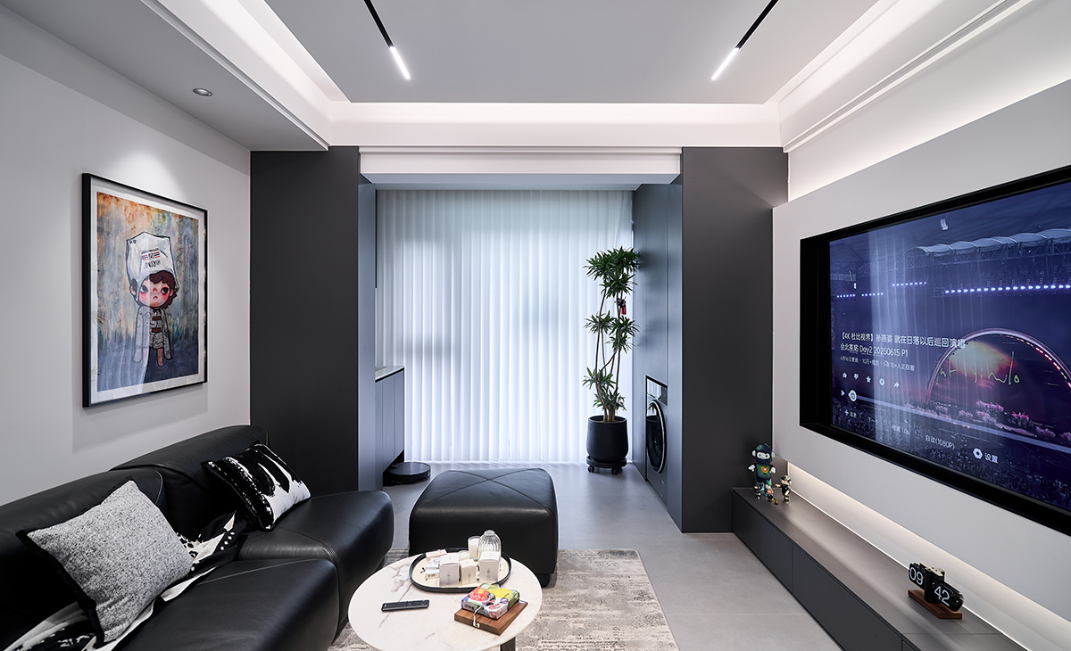 以 “冷靜秩序感 + 生活松弛感” 為核心，采用深灰 / 黑色啞光材質為基底，融入藝術軟裝與功能細節，打造適配都市年輕群體的 “質感型社交客廳”。