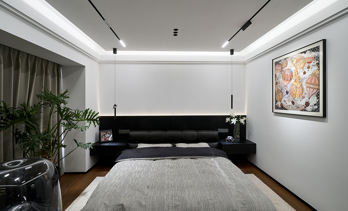 以 “睡眠 + 休閑 + 收納” 為核心，延續整體空間的暗調極簡基因，打造兼具靜謐睡眠氛圍與個性化休閑功能的私享臥室，適配都市人群 “沉浸式放松” 的生活需求